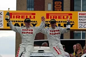 Images Dated 27th April 2003: British Rally Championship: Mark Higgins and Bryan Thomas celebrate on their car