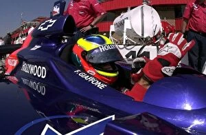 Images Dated 24th March 2002: Felipe Giaffone, (BRA), puts on his gloves prior to practice for the Yamaha 400