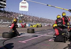 Images Dated 18th March 2002: De Ferran, Hornish, and Castroneves, pass by Al Unser Jr.s pit box during the Copper World 200
