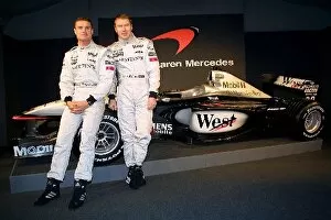 Images Dated 7th February 2001: Formula One Launch: David Coulthard and Mika Hakkinen pose with the new 2001 McLaren