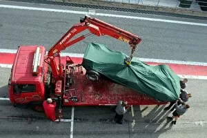 Images Dated 26th November 2004: Formula One Testing: The car of Vitantonio Liuzzi Red Bull Racing is returned to the pits on a truck