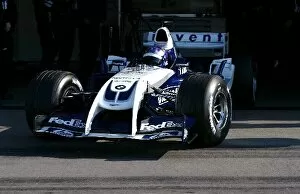 Images Dated 26th March 2004: Formula One Testing: IRL driver Scott Dixon Williams BMW FW26 leaves the pits during his first F1