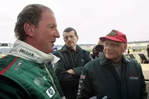 Images Dated 13th January 2002: Formula One Testing: Wolfgang Reitzle Chairman Jaguar Cars discusses the performance of the Jaguar