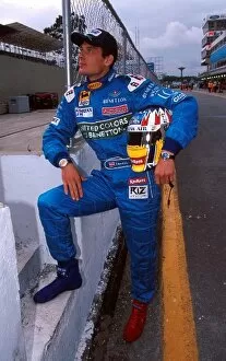 Images Dated 14th June 2001: Formula One World Championship: Alex Wurz attempts to model Benetton race wear for their mail