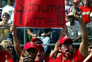 Images Dated 29th September 2002: Formula One World Championship: Some baffling english from Michael Schumacher Ferrari fans