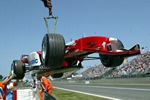 Images Dated 4th May 2003: Formula One World Championship: The car of Olivier Panis Toyota TF103 is craned away