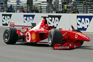 Images Dated 27th September 2002: Formula One World Championship: The damaged Ferrari F2002 of Rubens Barrichello following his big