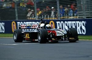 Images Dated 5th March 2002: Formula One World Championship: David Saelens gives a guest a ride of a lifetime in the Minardi