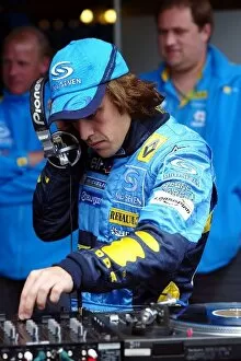 Images Dated 28th May 2004: Formula One World Championship: DJ Fernando Alonso Renault mixes on the decks
