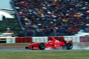 Images Dated 19th November 2003: Formula One World Championship: Eddie Irvine Ferrari F300 locks up on his way to 3rd place