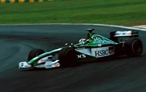 Images Dated 11th December 2000: Formula One World Championship: Eddie Irvine Jaguar Cosworth R1 spins and fails to finish