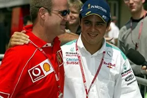 Images Dated 29th March 2002: Formula One World Championship: Fellow Brazilians Rubens Barrichello of Ferrari with Felipe Massa
