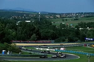 Images Dated 19th August 2002: Formula One World Championship: The field stream through turns two and three on lap one