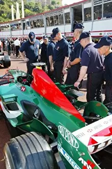Images Dated 19th May 2004: Formula One World Championship: Local police admire the Jaguar R5