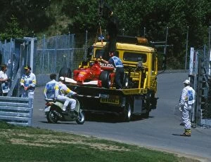Images Dated 25th June 2001: Formula One World Championship: Marshals recover Michael Schumachers car just before the race