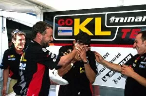 Images Dated 22nd July 2002: Formula One World Championship: Minardi team owner Paul Stoddart helps Alex Yoong celebrate his
