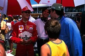 Images Dated 11th June 2001: Formula One World Championship: Nicholas Cage and his son meet Formula 1 Champion Michael