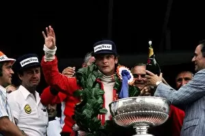 Formula One World Championship: Niki Lauda celebrates on the podium his first victory since his near-fatal accident at