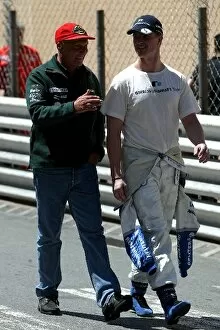 Images Dated 26th May 2002: Formula One World Championship: Niki Lauda walks in with Ralf Schumacher