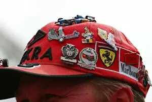 Images Dated 28th May 2004: Formula One World Championship: Pin badges on a Ferrari cap
