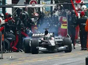 Images Dated 20th April 2003: Formula One World Championship: Race retiree Jos Verstappen Minardi Cosworth PS03 makes a pit stop