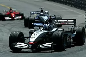 Images Dated 26th May 2002: Formula One World Championship: Race winner David Coulthard McLaren Mercedes MP4-17 is followed by
