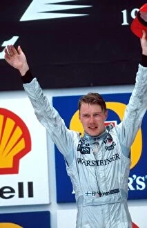 Images Dated 8th January 2001: Formula One World Championship: Race winner Mika Hakkinen McLaren on the podium