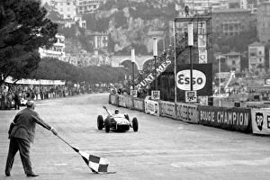 Monaco Collection: Formula One World Championship: Race winner Stirling Moss Lotus 18 crosses the finish line