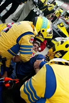 Images Dated 7th June 2002: Formula One World Championship: The safety team practice removing a Sauber team member from the car