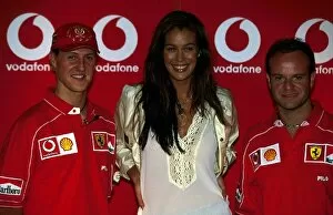 Images Dated 16th September 2002: Formula One World Championship: Second placed Michael Schumacher Ferrari; the face of Vodafone