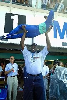 Images Dated 28th July 2001: Formula One World Championship: Shaquille O Neal LA Lakers basketball player hoist a somewhat