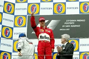 Images Dated 20th April 2003: Formula One World Championship: A sombre, emotional Michael Schumacher Ferrari on the podium after