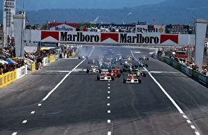 Images Dated 20th July 2004: Formula One World Championship: Winner Alain Prost McLaren MP4 / 5 leads the field away at the start