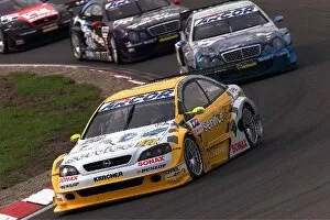 Images Dated 25th September 2001: German DTM Championship: Manuel Reuter Opel Astra V8 Coupe leads a train of DTM cars around