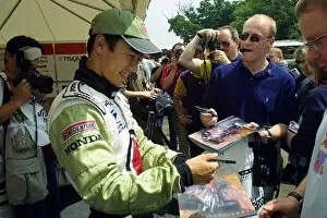 Images Dated 8th July 2001: Goodwood Festival of Speed: BAR test driver and British Formula 3 star Takuma Sato happily signs