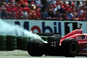 Images Dated 28th July 1996: IRVINEs FERRARI BLOWS UP IN GERMAN GP