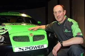 Images Dated 1st March 2002: MG X Power 2002 Launch: Gwyndaf Evans poses with the Super 1600 MG ZR EX258 rally car that he will