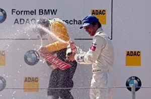 Images Dated 21st June 2003: Michael Devaney (IRE), Team Rosberg, left, gets a champaign shower from Timo Lienemann