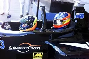 Images Dated 21st August 2001: Minardi 2 Seater Celebrity Day: Tarso Marques takes team mate Fernando Alonso for a ride in the 2