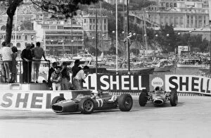 Images Dated 17th May 2006: Monte Carlo, Monaco. 22 May 1966: John Surtees, Ferrari 312, retired, leads Jackie Stewart