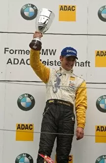 Images Dated 6th September 2003: Podium, Michael Devaney (IRE), Team Rosberg (1st), holding up the winner trophy