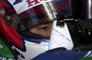 Images Dated 24th August 2002: Shinji Nakano studies the time sheet during qualifying for the Molson Indy Montreal