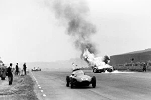 Images Dated 28th March 2006: Silverstone, Great Britain. 14 July 1956: Tony Brookss BRM P25 burns after he had crashed as