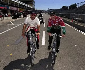 Images Dated 24th August 2002: Tony Kanaan and Adrian Fernandez pedal to their cars prior to qualifying for the Molson Indy