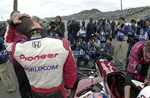 Tony Kanaan (BRA), does some stretching exercises prior to qualifying an excellent second for the Bridgestone Potenza