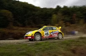 Images Dated 25th October 2002: Valentino Rossi Peugeot 206 WRC Test: Valentino Rossi and co-driver Carlo Casssina get up to speed