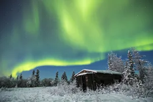 An Abandoned Cabin Along The Richardson Highway Sits Quiet In The Snow Beneath The Aurora On A Cold Winter Night An Abandoned Cabin Along The Richardson Highway Sits Quiet In The Snow Beneath The Aurora On A Cold Winter Night