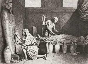 Ancient Egyptian funerary workers prepare a body for mummification. The worker on the right, the embalmer Ancient Egyptian funerary workers prepare a body for mummification. The worker on the right, the embalmer