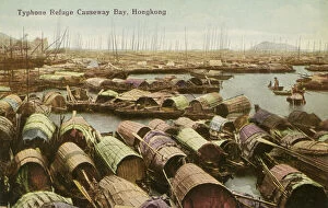 Archival color postcard of junks in harbor waiting for coming typhoon, Hong Kong, China, c 1910