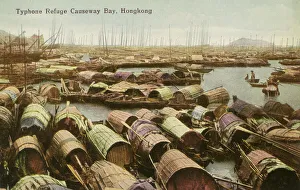 Archival color postcard of junks in harbor waiting for coming typhoon, Hong Kong, China, c 1910 Archival color postcard of junks in harbor waiting for coming typhoon, Hong Kong, China, c 1910
